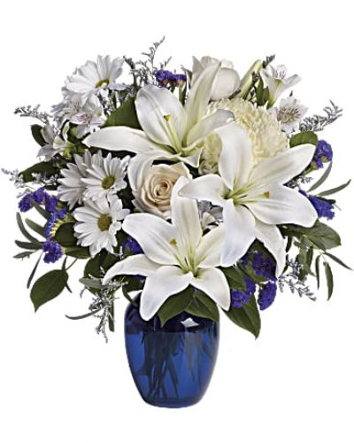 <div class="m-pdp-tabs-description">
<div id="mark-1" class="m-pdp-tabs-marketing-description">In this arrangement, the serenity of the color blue along with the purity of intention symbolized by white will express your feelings wonderfully.</div>
</div>
<p id="arrngDescp">Beautiful blooms such as blue hydrangea, crème roses, white lilies and alstroemeria along with yellow and white chrysanthemums, eucalyptus, limonium and more are beautifully arranged in a dazzling blue vase.</p>